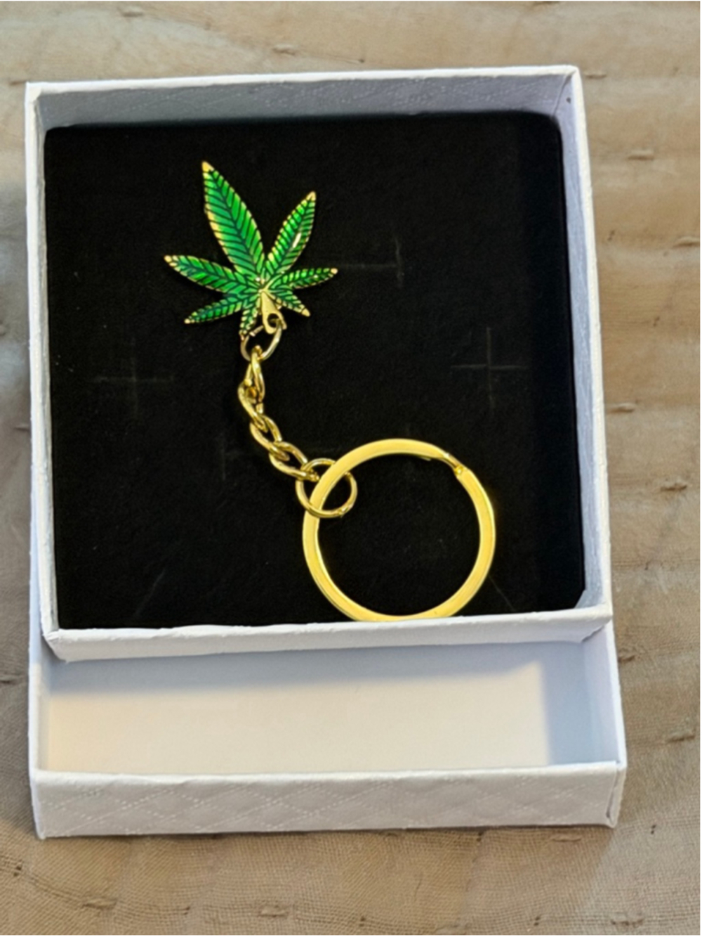 Aura’s Oddities “Maple Leaf” Mary Jane green and gold key chain in a gift box